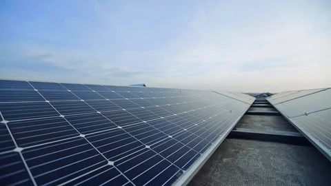 Solar panels in rows under the blue sky. Photovoltaic panels in sunlight. Stock Footage 124419842