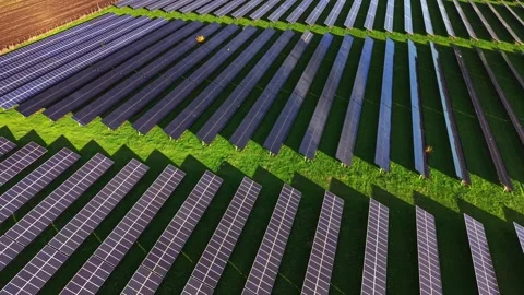 Solar panels stretch across an expansive field in aerial view Stock Footage 325090478