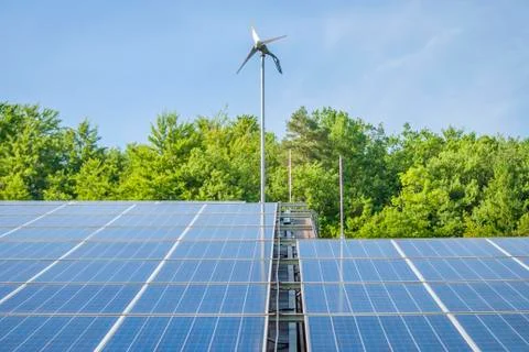 Solar panels with wind generator close-up Stock Photos