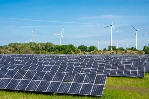 Solar panels with wind wheels Stock Photos