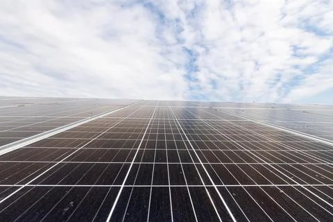 Solar park. Blue sky with clouds. Stock Photos