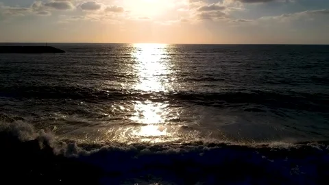 Solar path over the storming sea. Video stock 135478523