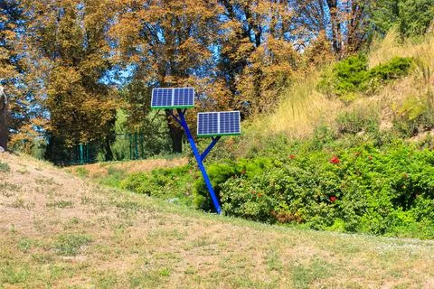 Solar power array panels installed in park for charging phones.Battery generator Fotos de archivo