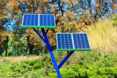Solar power array panels installed in park for charging phones.Battery generator Fotos de archivo