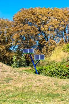 Solar power array panels installed in park for charging phones.Battery generator Fotos de archivo