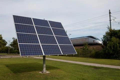 Solar power next to train tracks Stock Photos
