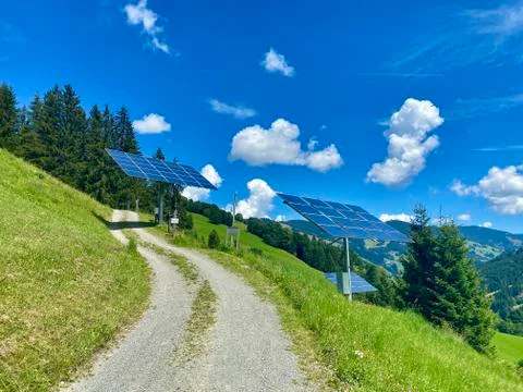 Solar power panels in front of a eco-friendly mountain resort in Saalbach Stock Photos