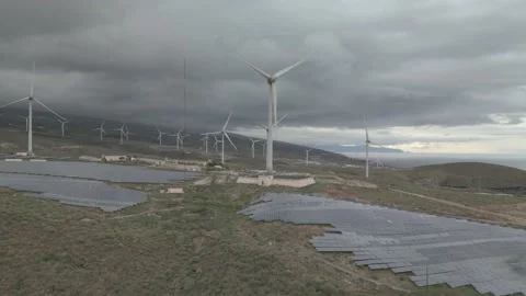 Solar power plant with solar panels and wind turbines Stock Footage 234786006