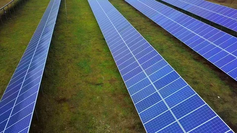 Solar power plant in summer. Innovative solar batteries on the field. Production Stock Footage 129076832