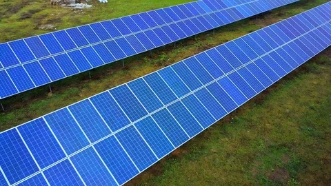 Solar power plant in summer. Innovative solar batteries on the field. Production Stock Footage 129077111
