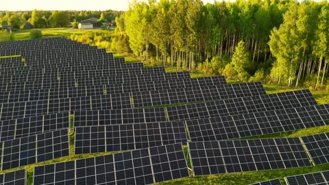 Solar power plant at sunset solar farm with photovoltaic panels IN Estonia Stock Footage 270785585