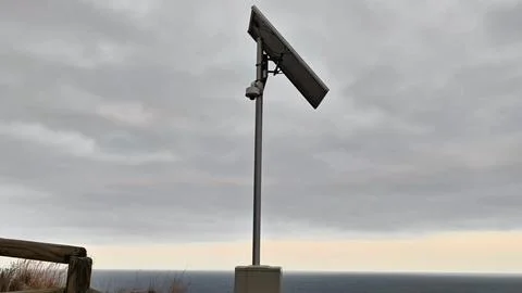 A Solar Power System that is Mounted on a Pole, Offering a Spectacular View of Stock Photos