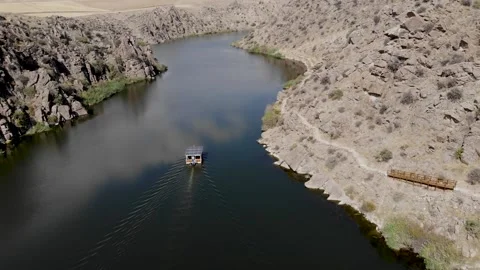 Solar powered boat canyon view over river Stock Footage 144976366