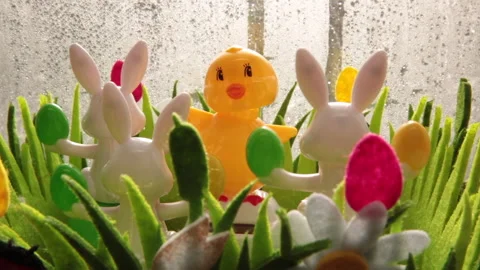 Solar powered Easter toys in Window frame Stock Footage 148161357