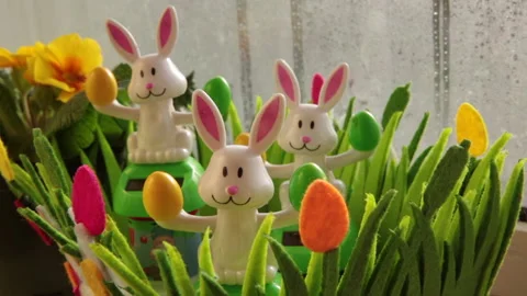 Solar powered Easter toys in Window frame Stock Footage 148161359
