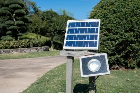 Solar-powered LED light on the sidewalk.	 Stock Photos