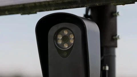 Solar Powered License Plate Reader Beneath a Roadside Solar Panel Video stock 346406426