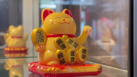 Solar Powered Maneki-Neko Lucky Cat Waving Arm for Good Fortune and Wealth Stock Footage 330145562