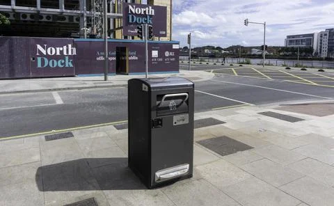 A solar powered refuse compactor bin. Stock Photos