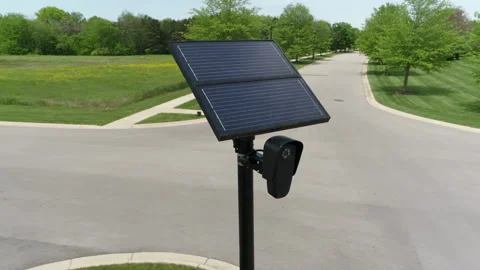 Solar Powered Roadside Camera Beside a Tree Lined Intersection Stock-Footage 346407104