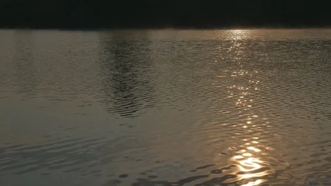 Solar reflections and glare on the surface of soothing waves of water in summer Stock Footage 117521695