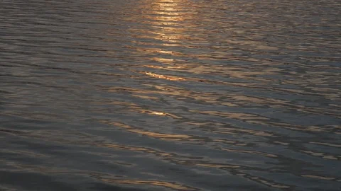Solar reflections and glare on the surface of soothing waves of water in summer Stock Footage 119283837