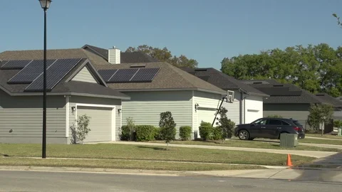Solar rooftop mounted on 4 homes in a row Stock Footage 96163970