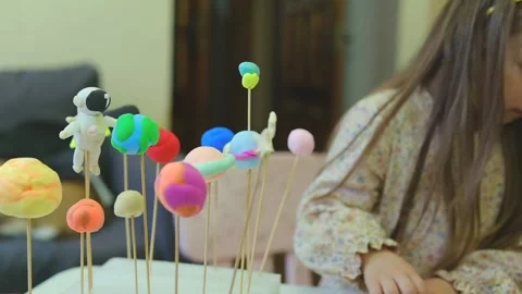 Solar system model hanging over the kid bed. DIY Stock-Footage 279658831
