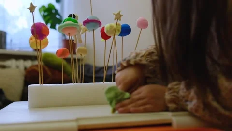 Solar system model hanging over the kid bed. DIY Stock-Footage 279658847