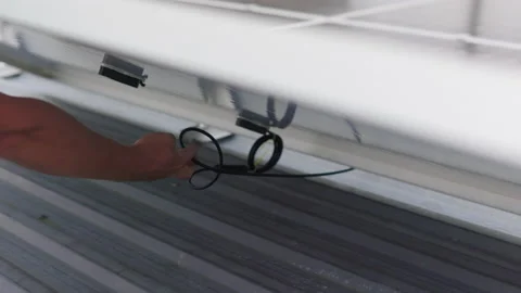 Solar technician installing solar panels on roof. Concept of Ecological Stock Footage 160959970