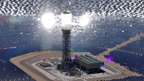 Solar Tower Surrounded by Mirror Array in Harsh Terrain Stock Footage 312905454