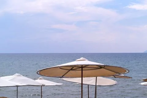 Solar umbrellas on the beach Stock Photos