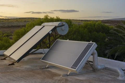 Solar warm water heating system installed on a residential rooftop Stock Photos