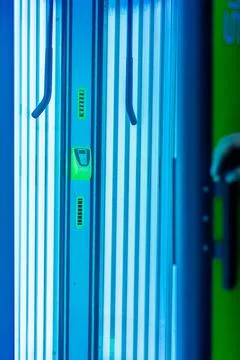 Solarium empty tanning bed in modern beauty salon, view from inside with cl.. Stock Photos