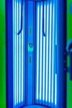 Solarium empty tanning bed in modern beauty salon, view from inside with cl.. Stock Photos
