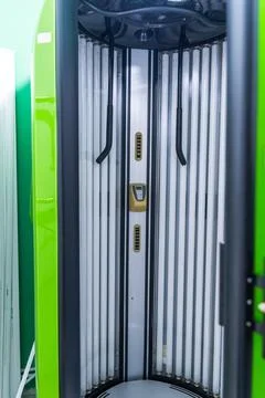 Solarium empty tanning bed in modern beauty salon, view from inside with cl.. Stock Photos