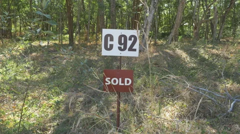 Sold sign in front of plot of land. Costa Rica. 스톡 동영상 49396308