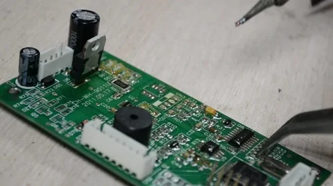 Solder electronic board using a soldering iron Stock Footage 51054282