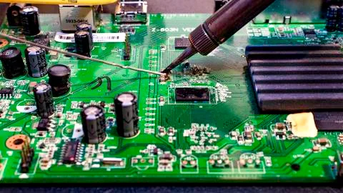 Solder on green. Stock Photos