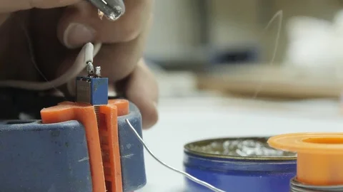 Soldering cables on a power switch Stock Footage 80864334
