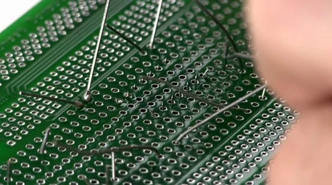 Soldering circuit with through hole IC; 2 Stock Footage 10588880