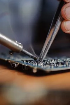 Soldering computer board Stock Photos