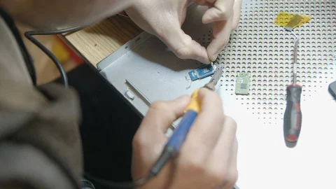 Soldering a Computer Chip in Slow Motion. Stock Footage 101522730