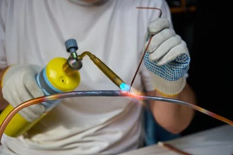 Soldering copper pipes 스톡 사진