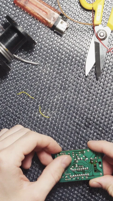 Soldering electronic boards, solder paste, tin close-up Vertical video. Stock Footage 241520316