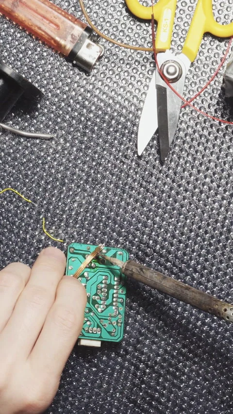Soldering electronic boards, solder paste, tin close-up Vertical video. Stock Footage 241520619