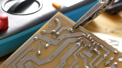 Soldering of electronic circuit board with electronic components. Engineers r Video stock 125760352