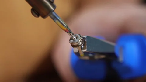 Soldering electronic component held with tweezers Stock Footage 327303813
