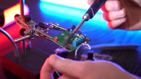 Soldering electronic components on the board in slow motion Stock Footage 171870221