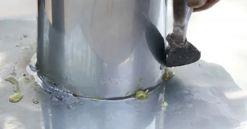 Soldering metal with a Hand tool Stock Footage 74583439